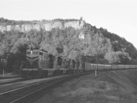 [Editors note - we're taking this due to rarity of subject matter and the substantial restoration work done on this - You the Viewer can decide if you like this - we'll happily take any constructive criticism for future editing notes for the Doug Page team] Train Number 5, the "LaSalle" eases up to its station stop at Dundas on a fine summer's evening in 1962. She has lots of power tonight for the 11 car consist--GTW GP9s 4912 and 4918 (the latter in the "new" orange/black colours) as well as CN RS18 3102 and an unidentified sister.