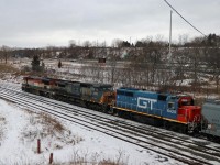 While waiting for CN 148 with reported FPON, I was pleasantly surprised by 383 with the interesting consist of BCOL C40-8m 4623, GECX 7676 (ex CSX C40-8W) and GTW GP40-2 6420, one of the last units still in "Burdakin blue". (They met 148 with a UP leader around Dundas.)