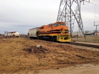 Goderich-Exeter Railway train 582 with GP40-2L(W) 3030 is seen reversing through the interchange in Guelph, Ontario with one hopper as they head to the nearby Traxxside Transloading facility.