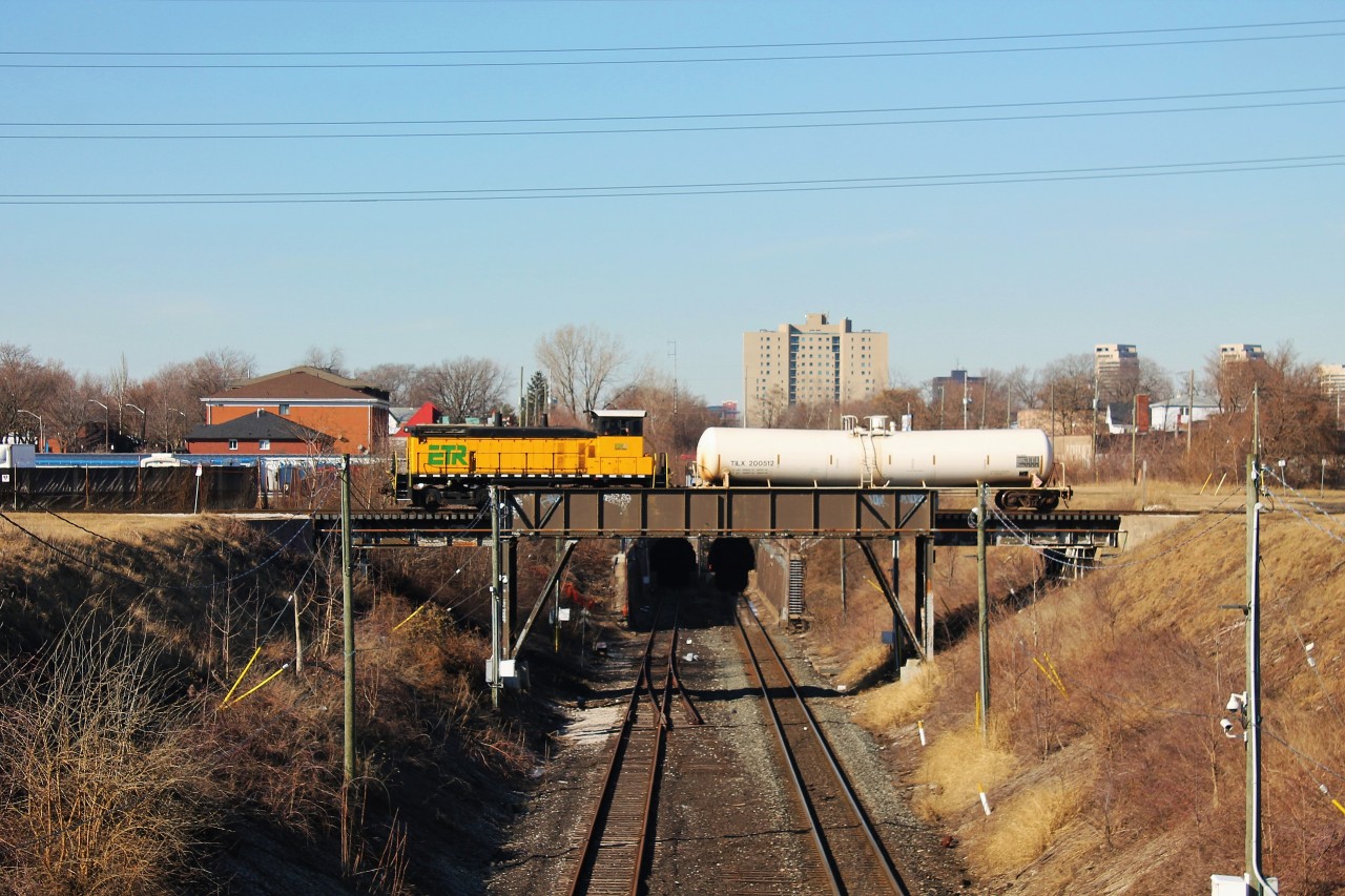 An Essex Terminal Railway local crosses over the cut for the Detroit River rail tunnel. The tank car is for Crown Royal (Diageo) in Amherstburg, ON. I was about 3 minutes from getting a perfect over/under meet here as CP 240 emerged from the tunnel not too long after 107 passed.