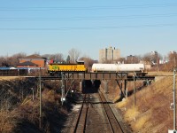 An Essex Terminal Railway local crosses over the cut for the Detroit River rail tunnel. The tank car is for Crown Royal (Diageo) in Amherstburg, ON. I was about 3 minutes from getting a perfect over/under meet here as CP 240 emerged from the tunnel not too long after 107 passed. 