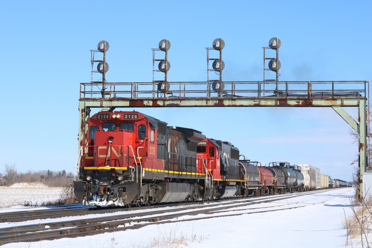 After lifting 6 cars, 331 is slowly pulling away from Paris West with a pair of standard cabs leading.