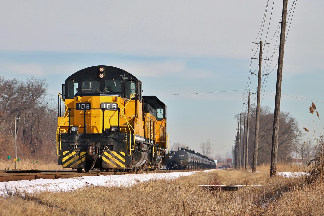 108 and 104 wait patiently as their crew takes a lunch break at a nearby Tim Horton's across from Ojibway Yard in Windsor.
