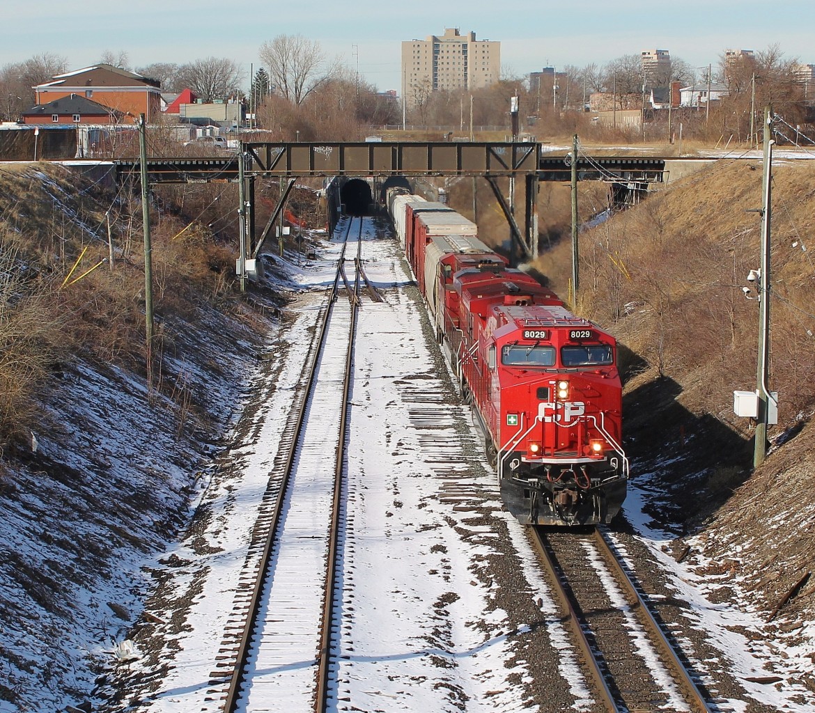CP 140 enters Canada via the Detroit River rail tunnel with a clean rebuild on the point.