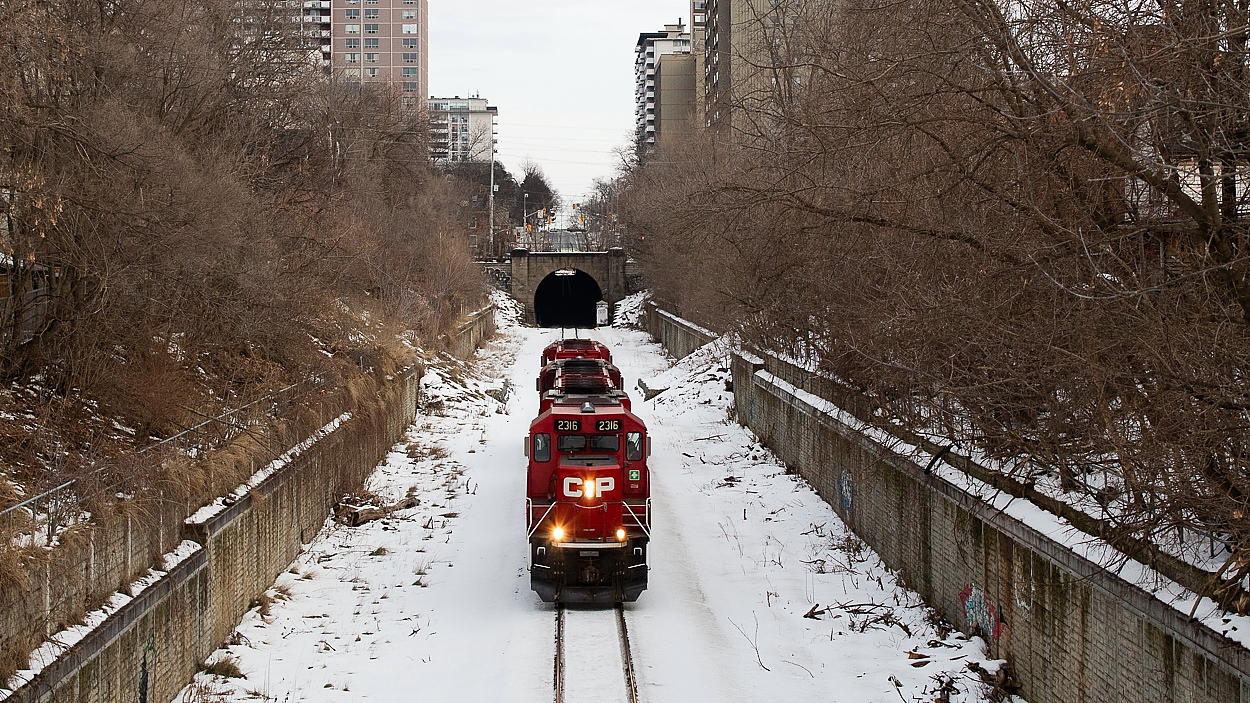 I've been told by a crew member that the pushing on the Hamilton Sub typically takes place at night these days - for 142 and 247 I think. However, both trains have been running late at times recently with the winter weather, making for a chance to see the pushers on the mainline on their way to help. Which is lucky for me - I missed a shot of 142 here by mere minutes but then heard the pushers would be coming once the crew was ready to go. Here, TH41 is on its way to meet a very late and waiting 142 at Desjardins. This was the 15:00 crew's first order of business on this Sunday afternoon. 254 would follow southbound mere minutes after TH41 passed through.