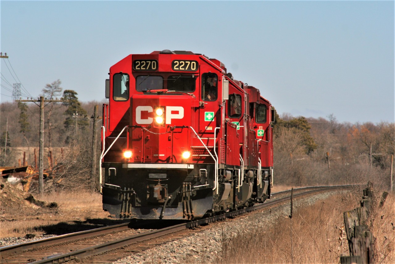 The CP Wolverton Job is just light power as it hustles along approaching Dumfries with GP20C-ECO 2270, GP38-2 3113 and GP20C-ECO 2263. The units will soon work on the Ayr Pit Spur, just west of this location in Ayr.