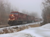Out of the fog and freezing drizzle comes CP 246 headed south with CP 8720 and CP 9537 for power hauling a special car with TTC streetcar 4478 along for the ride where it will be dropped of in Welland.