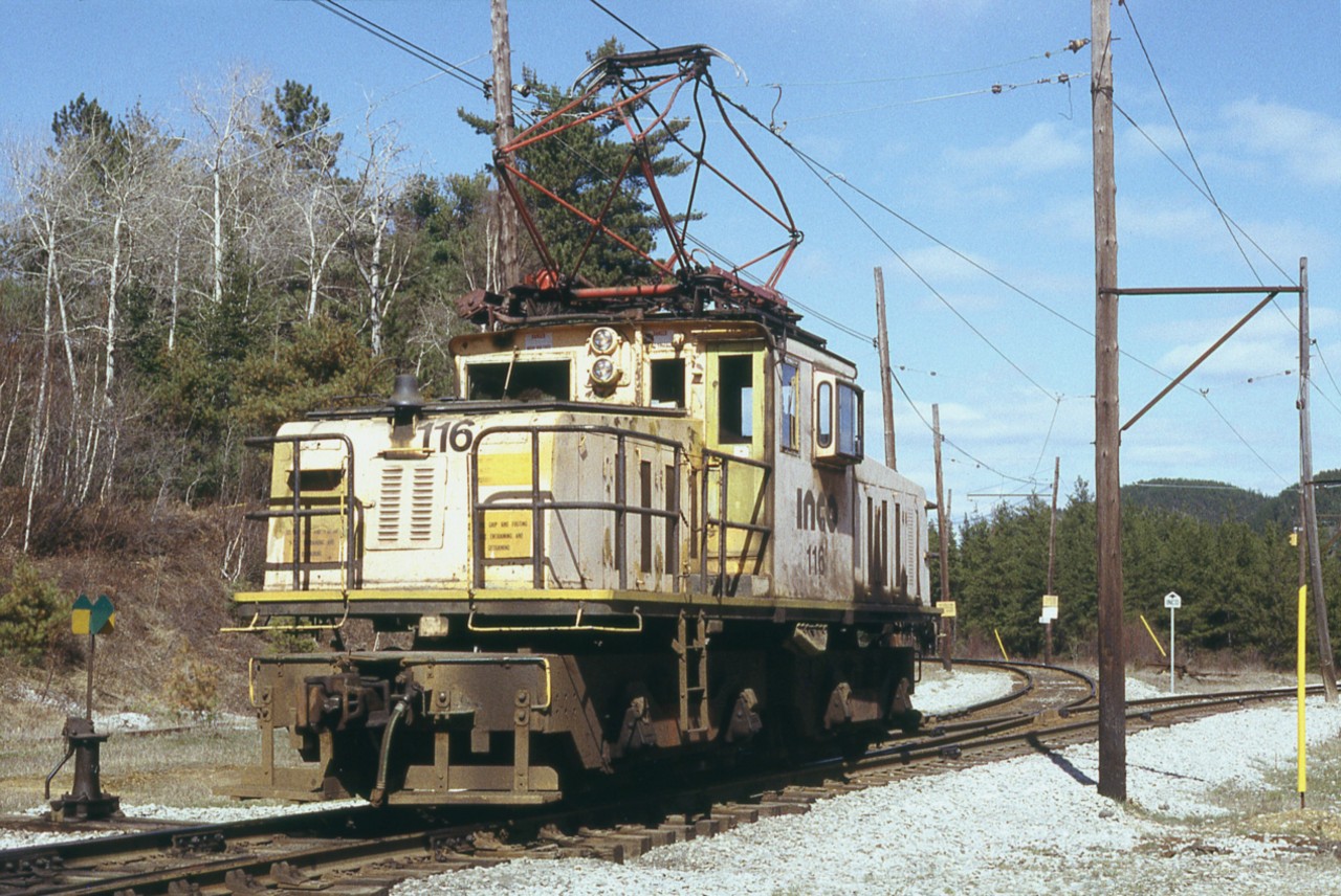 Rather tired looking INCO 116 GE 100T at switch awaiting instruction. This unit was rebuilt the following year, and then retired in 2001 as Vale Industries took over from INCO in 2000 and favoured the diesel. Photo taken not far from the INCO connector at CP 'Levack', (mile 104.3 Cartier Sub)  alongside Hwy 144.