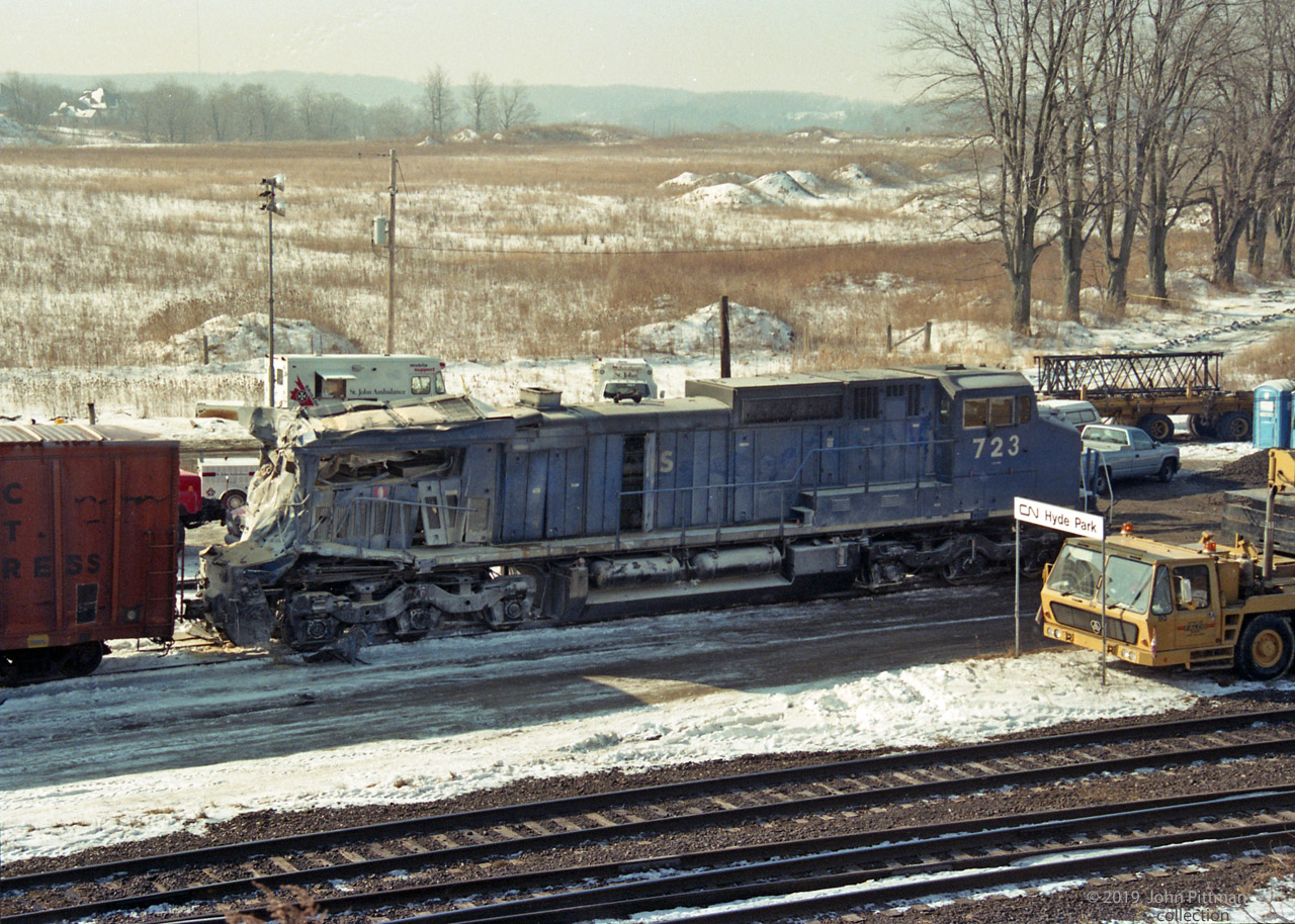 Submitted on the 24th anniversary of the Hyde Park train crash.  I recommend the TSB Report about this mishap -   http://www.bst-tsb.gc.ca/eng/rapports-reports/rail/1995/r95s0021/r95s0021.asp 
 In the collison with the tail end of CN train 308, Bombardier HR616 CN 2105 (lead unit of train 272) left the tracks and spun about 135 degrees.  Tail-first trailing unit LMSX 723 (GE Dash 8-40CW) and several of train 272's front end boxcars derailed but stayed in-line with the rails, the forward momentum of their train resulting in them overtaking CN 2105, impacting and pushing forward train 308.  Among 308's destroyed tail-end railcars was a hopper. LMSX 723 also took serious collision damage, and looks like the hopper load has whitened it. 
Less than a year old at the time, LMSX 723 was taken to Conrail's ex-PRR Juniata Shop in Altoona PA where it was repaired and returned to service. 
You can click on "Photographer" for a couple of other views, including prior-to-cleanup image 36332.
