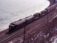 1967 was a good year for train watching in southern Ontario. Not only was it Centennial year with its extra passenger traffic, we had a new commuter service into Toronto (the now well-established GO Transit), new locomotives (C424s, GP40s and SD40s on CN; SD40s and C424s delivered in 1966 on CP); the "last hurrah" for older MLW and CLC locomotives on CN before retirement; the last full year of NYC operations in Canada; the final year before adoption of the CP Rail paint scheme; 6218 excursions; and leased locomotives! For much of 1967, CN leased several N&W F7As and used them between Toronto, Fort Erie, Windsor, and Sarnia, sometimes in N&W only consists and sometimes mixed in with CN power. (There is even one known case of an N&W F7A-Ontario Northland FP7 combination!)

Here we see an eastbound train working Hamilton with a pair of N&W F7As and a pair of CN GP9s. "Those were the days, my friend!"