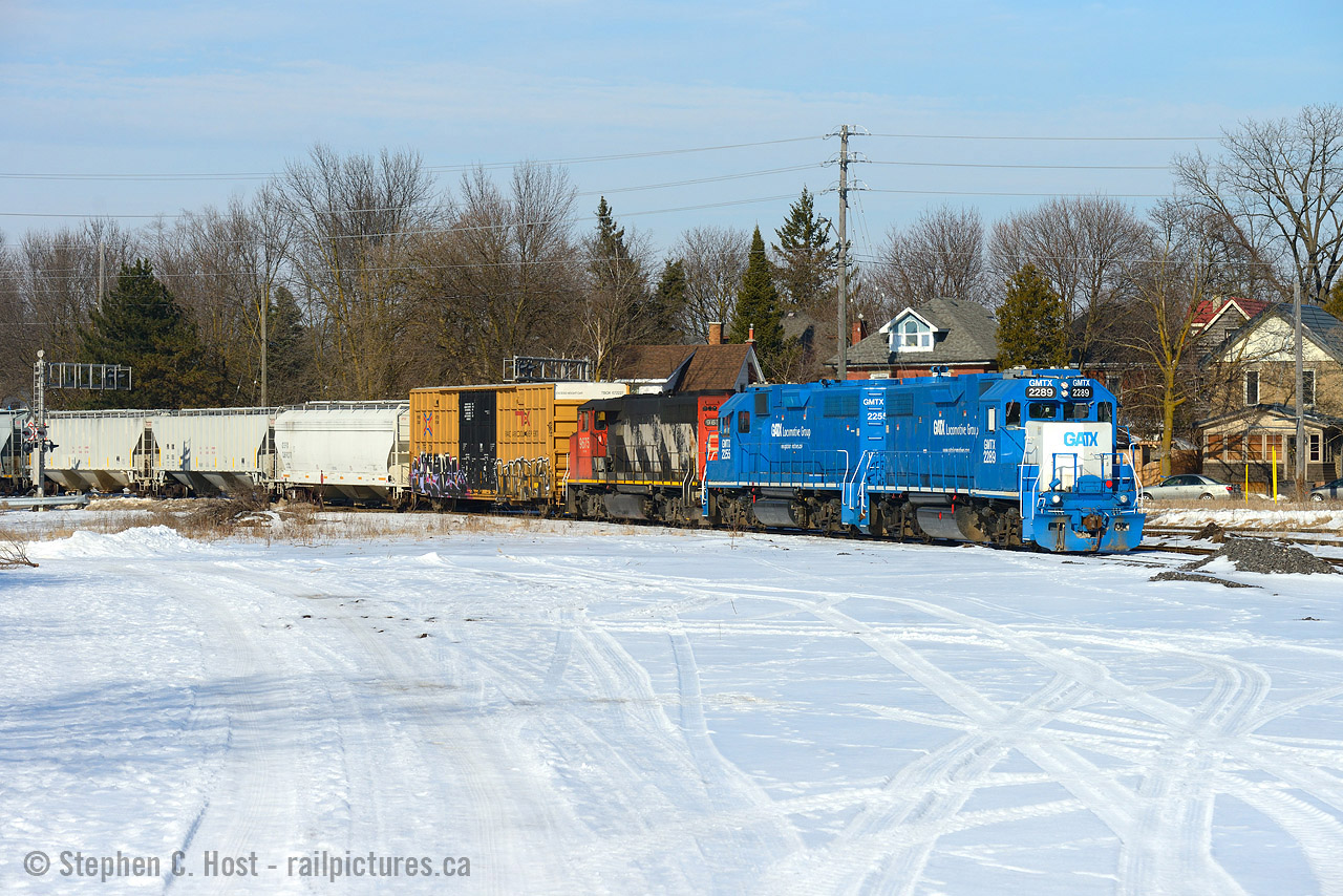 Three units on this job was somewhat rare on GEXR, and I last photographed a triplet back in 2014 when OSR's ex CP 8235 was on lease to GEXR. This past weekend 540 came over to Guelph with the big set of power, normally used on 568. After finishing working the north end of Guelph I was able to photograph the train southbound at Edinburgh/Paisley Rd in really nice sunlight.  History lesson time: Knight Lumber used to occupy this site and was demolished around 2012 opening up this angle. Further back this used to be the terminus (yard and station) of the Galt and Guelph Railway (Great Western) built in 1857 which by 1871 was further extended north to Fergus, Palmerston and Southampton (as the Wellington Grey and Bruce Railway) which was  all acquired by the Grand Trunk Railway by 1882. With the extension to Southampton and with Palmerston as a division point for other Branches a lot of traffic from Toronto ran through here (passenger and freight) but it was quickly deteriorating by the mid to late 60's. Around 1970 passenger service stopped, but a new Nuclear plant was built at Douglas Point near Southampton and new life was breathed into the old Wellington Grey and Bruce with 80 car oil trains running along 100 miles of upgraded (fortified) branchlines from Guelph until 1975  today's oil trains are not new and imagine them running on such rickety and well worn track as it was then! CN now services this branchline 6 to 7 days a week. If anyone has pictures of the Oil Trains along the Bruce Branches consider pulling out out to share :) Thank you.
