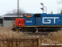 Burdakin Blue zooms past my camera as Sarnia's Plank Rd job switches "A" yard. Photo notes: 1/13 second handheld.