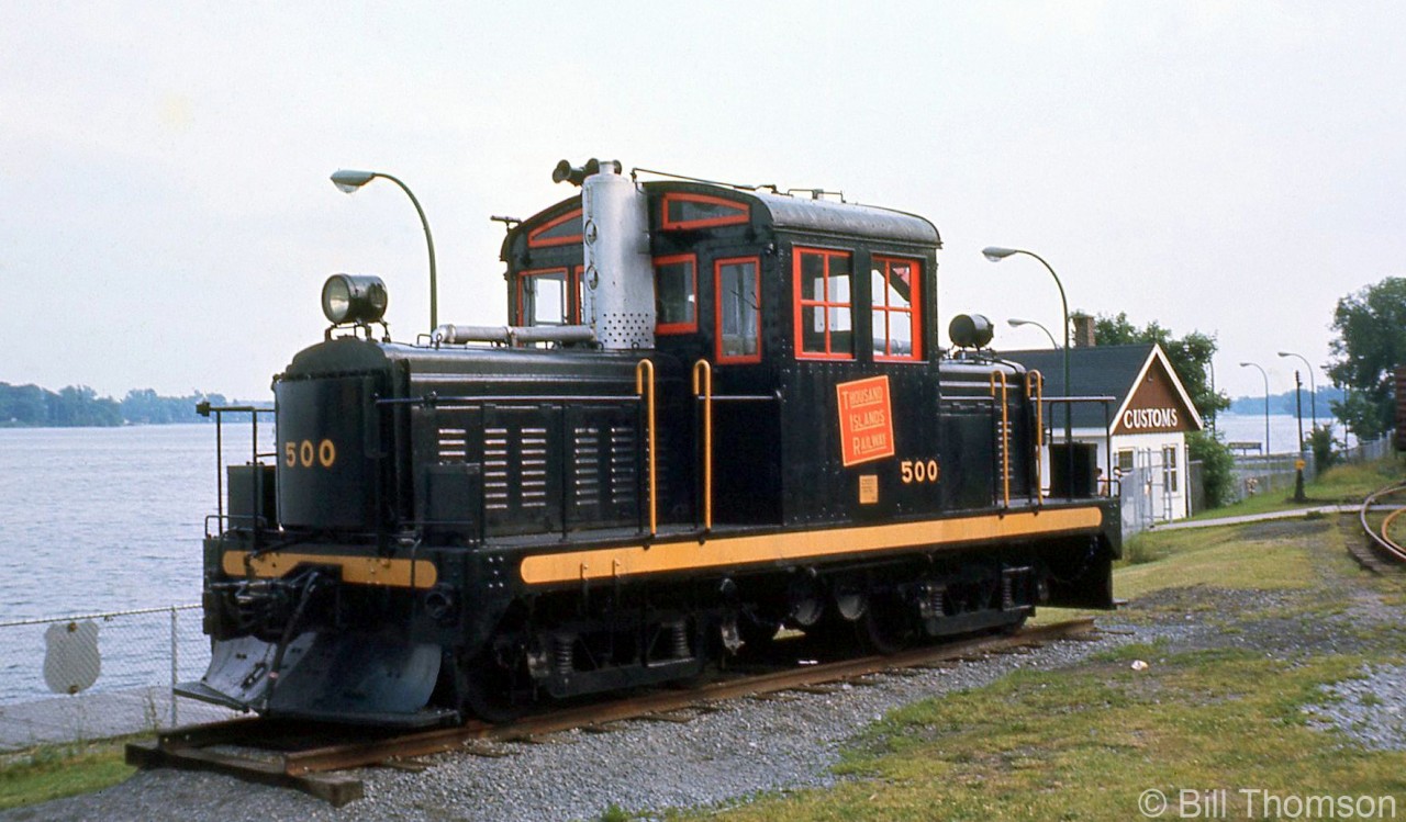 Thousand Islands Railway locomotive 300 is shown on display by the Gananoque River at Sculpture Park in Gananoque, a few years after retirement by CN. This was a one-of-a-kind home-built locomotive dating from 1930 that ran on the TIR for years until it was retired in 1963, and put on display in 1966.