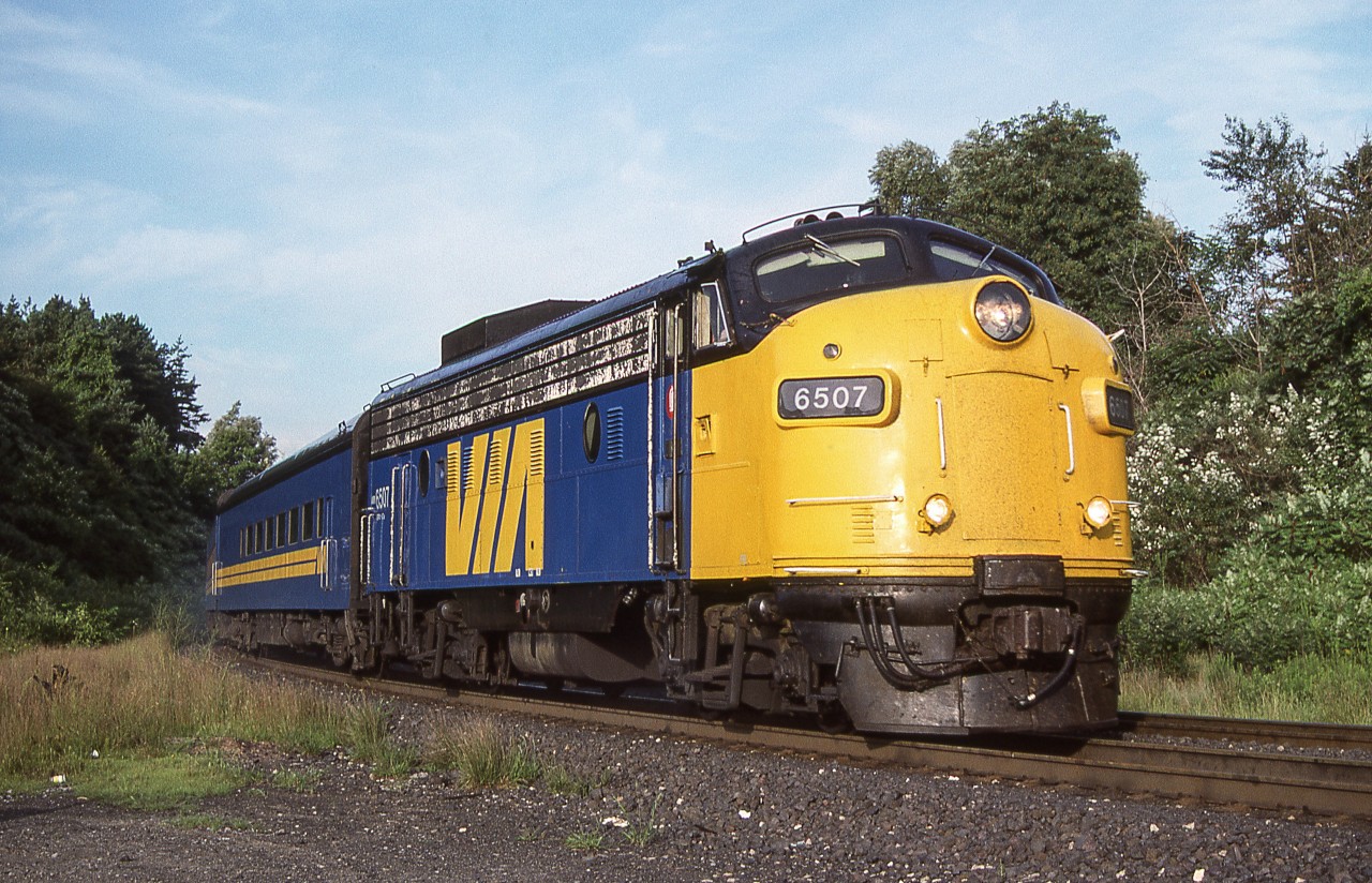 VIA 6507 is eastbound at Bayview Junction, Ontario on August 11, 1987.