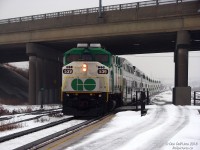 Working the last morning GO train from Georgetown, GO Transit F59PH 539 has its steel bell pinging and ditch lights flicked off as it leads train #210's "L10" consist out of the fog and slows for a stop at the Bramalea GO station (on time at 8:08am), ducking under the Bramalea Road overpass at the west end of the platforms. I was always curious about the long-disused elevated platform with wooden handrails at this end of the station, but from digging around aerial shots it was probably constructed as a temporary platform for the accessible coach while the station was undergoing platform expansion around 2002-ish.<br><br>539 would have a good year and change left in service: after working throughout 2009 it was stored in January 2010, and was part of the 536-540 group sold and moved to RB Leasing in Lachine Quebec during March 2010 (displaced by the second order of new MP40's arriving). 539's disposition is unknown after that; it doesn't seem to have been leased out or resold like other RBRX units were.
