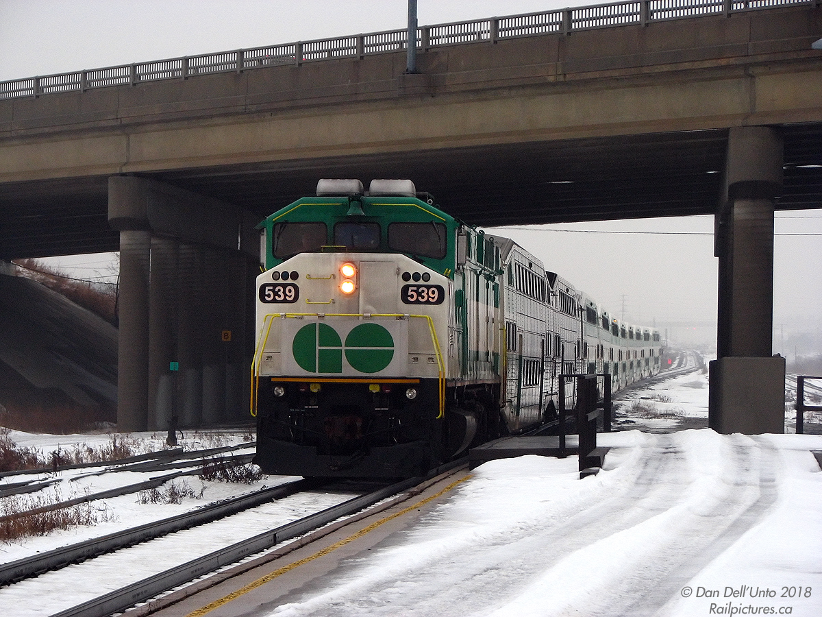 Working the last morning GO train from Georgetown, GO Transit F59PH 539 has its steel bell pinging and ditch lights flicked off as it leads train #210's "L10" consist out of the fog and slows for a stop at the Bramalea GO station (on time at 8:08am), ducking under the Bramalea Road overpass at the west end of the platforms. I was always curious about the long-disused elevated platform with wooden handrails at this end of the station, but from digging around aerial shots it was probably constructed as a temporary platform for the accessible coach while the station was undergoing platform expansion around 2002-ish.

539 would have a good year and change left in service: after working throughout 2009 it was stored in January 2010, and was part of the 536-540 group sold and moved to RB Leasing in Lachine Quebec during March 2010 (displaced by the second order of new MP40's arriving). 539's disposition is unknown after that; it doesn't seem to have been leased out or resold like other RBRX unit were.