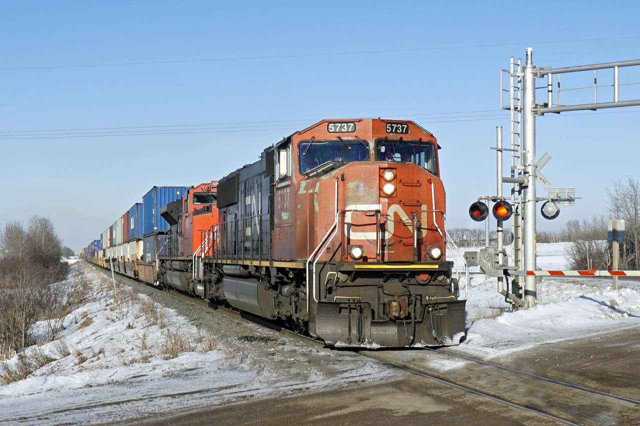 SD75I CN 5737 and SD70M-2 CN 8830 head south with an intermodal on the Camrose sub.