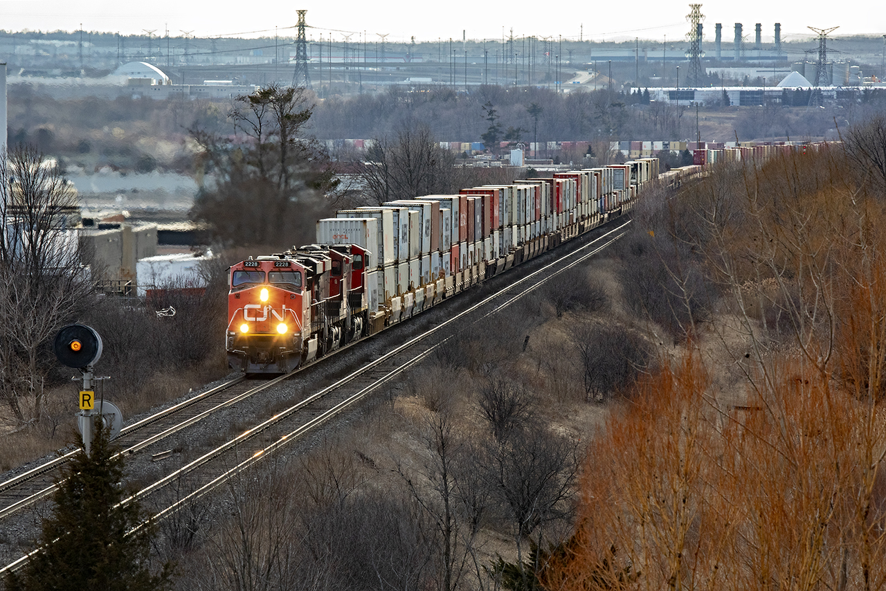 2228, 2221, and 2658 are well into their fight out of the Humber River dip as 148 continues its long trip to Montreal. The tail end is still coming down the hill, and is strung across the Humber River bridge