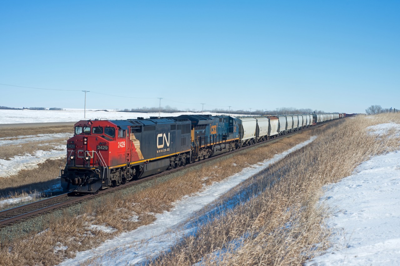 FPSK ?  CN 2429 and CSX 3296 lead train 347 west through the thawing prairies.