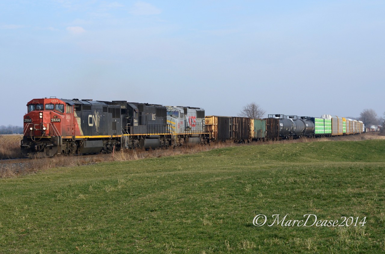 I was just a rookie when I shot this and at the time there was a lot of foreign power passing through Sarnia so this KCS trailer was no big deal at the time. Boy would I love to see this trio today, CN 2444, IC 1025 and KCS 3916 head west at Camlachie Sideroad.