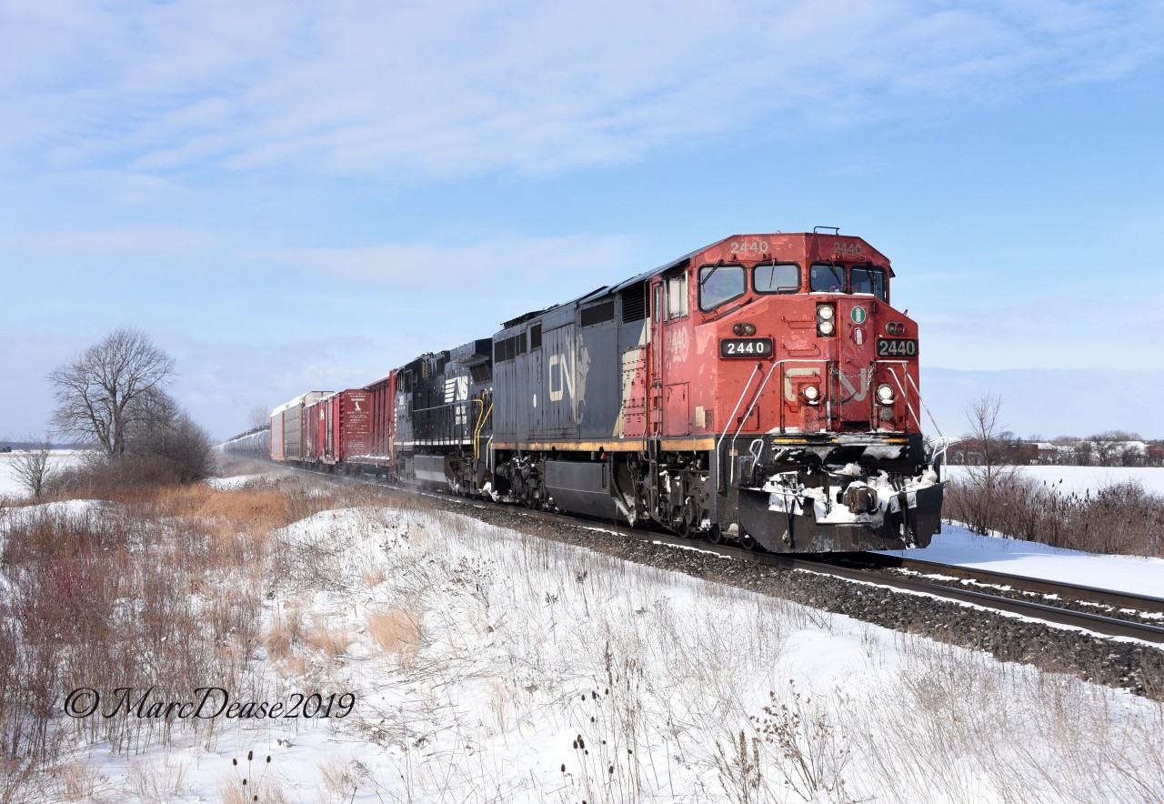 CN 2440 with NS 9851 head east bound back to London, ON., at Fairweather Sideroad.