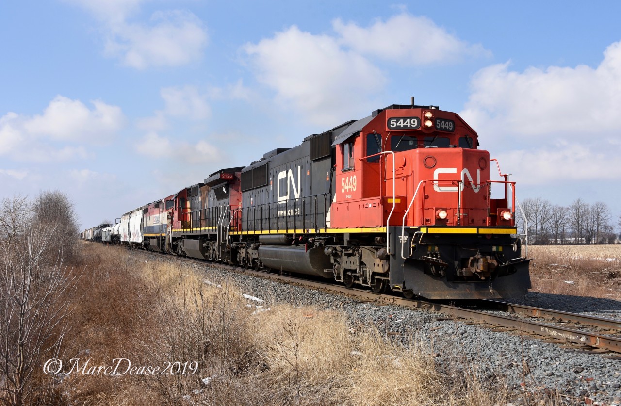 CN 5449, CN 2126 and BCOL lead train 394 east out of Sarnia, ON., at Fairweather Sideroad.