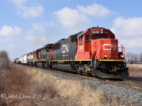 CN 5449, CN 2126 and BCOL lead train 394 east out of Sarnia, ON., at Fairweather Sideroad.