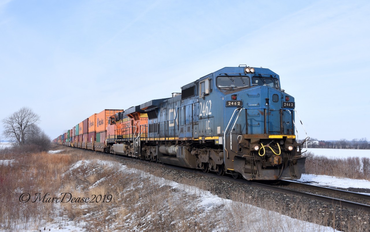 IC 2462 with BNSF 6145 lead train 148 east out of Sarnia, ON., at Fairweather Sideroad.