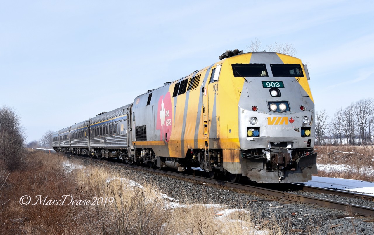 Catching a VIA train in daylight out of Sarnia, ON., is limited to early summer mornings due to its 06:10 departure time. Catching one in the winter is almost non existent however since they had arrived very late the night before this meant a very late departure the next morning. Here a late running train 84 heads east bound outside of Wyoming ON.