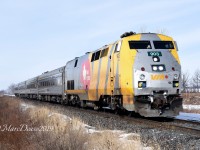 Catching a VIA train in daylight out of Sarnia, ON., is limited to early summer mornings due to its 06:10 departure time. Catching one in the winter is almost non existent however since they had arrived very late the night before this meant a very late departure the next morning. Here a late running train 84 heads east bound outside of Wyoming ON.