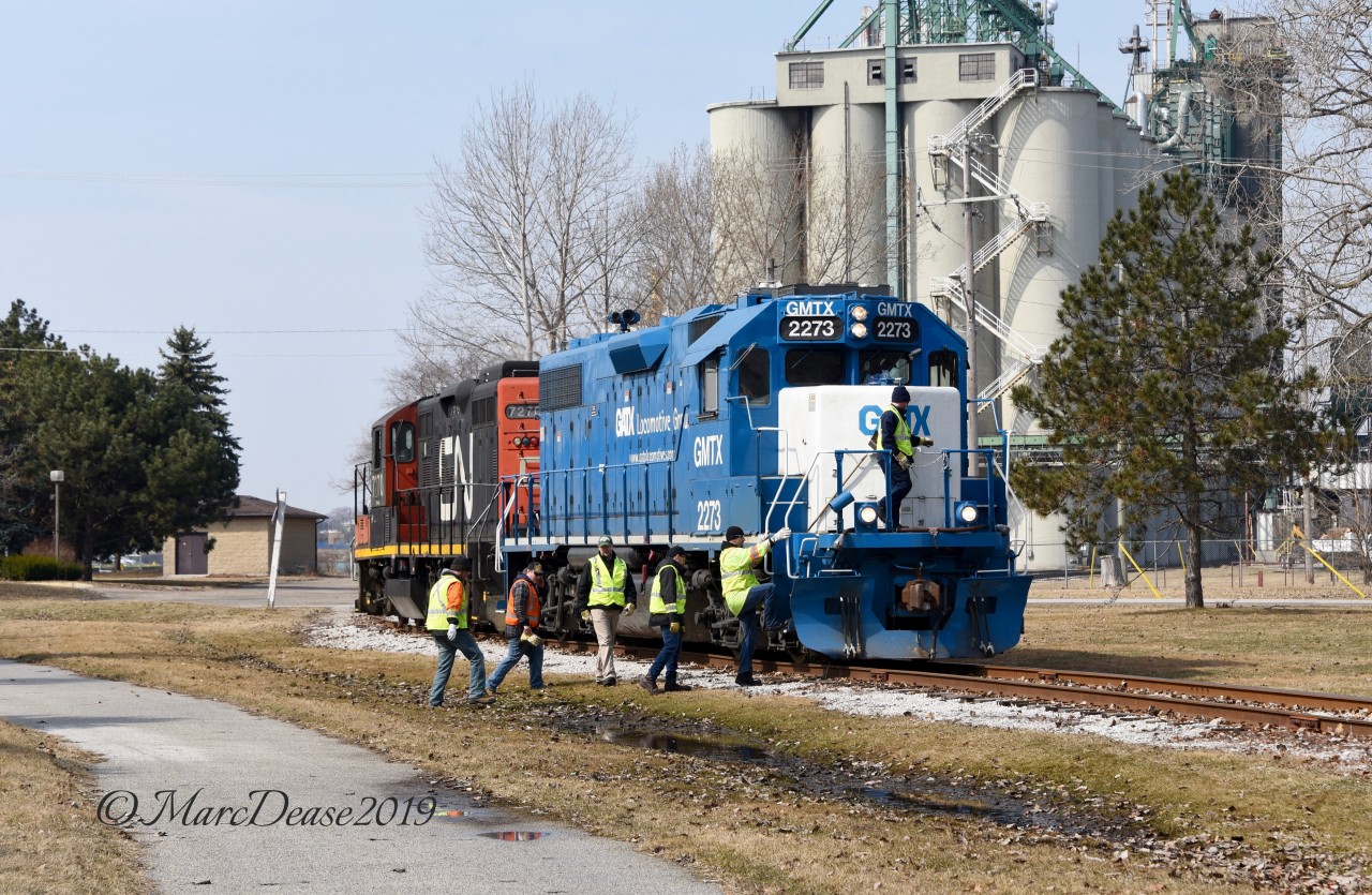 Sarnia, ON., yard switchers CN 7270 and GMTX 2273 ventured down to the elevator this morning on what's known as the "Teddy Bear Express". A training session for new hires(yellow vests) under the watchful of eyes of a veteran conductor(orange vest) and engineer.