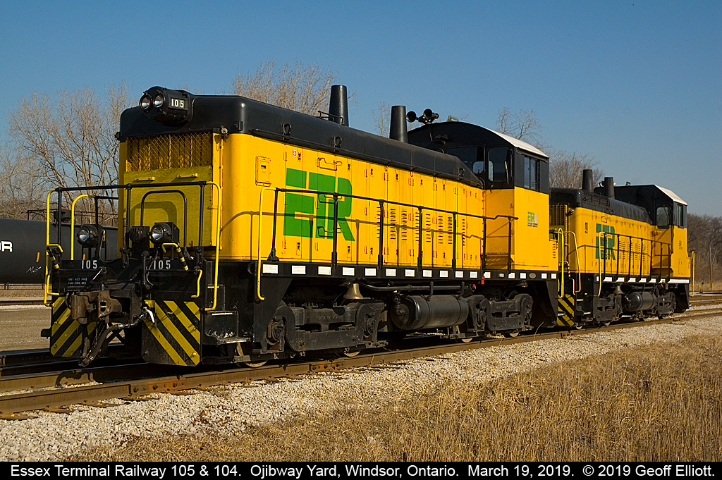 Essex Terminal Railway SW9 #105 and SW14 #104 take a break from their switching duties at Ojibway Yard while the crew is off for 'beans' at the nearby Tim Horton's.