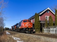 Still sporting it's new paint smell, a pair of brand new AC's (3874 trailing), lead train 406, as they pass by the old railway station in Rothesay, New Brunswick. It's not very often that power this new makes it down on this subdivision. 