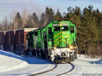 With some nice late day sun reflecting on the snow, NBSR 6319 rounds the bend, at Tracy, New Brunswick. 