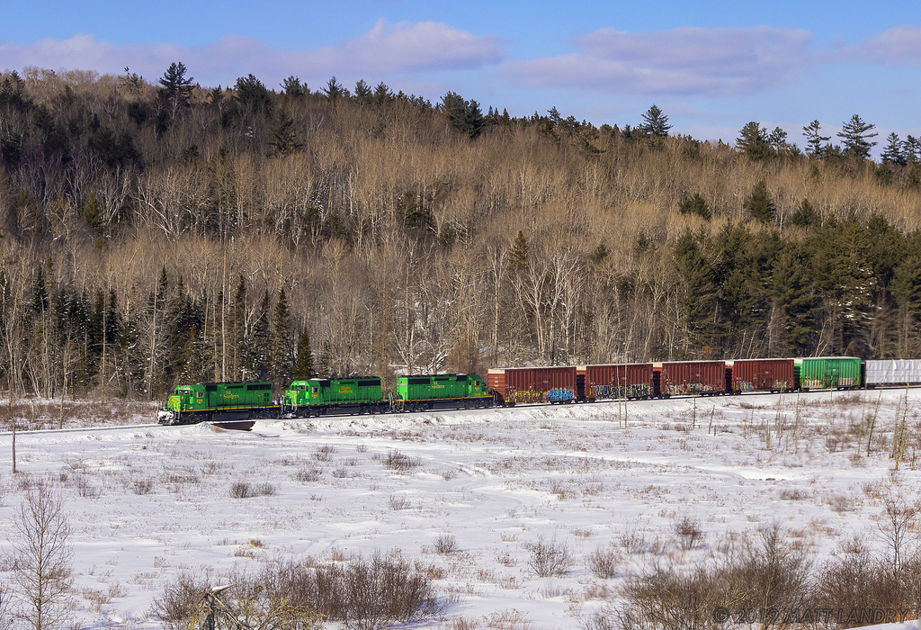 NBSR 6319 leads a trio of green power through the winter fields of Southern New Brunswick, at Clarendon.