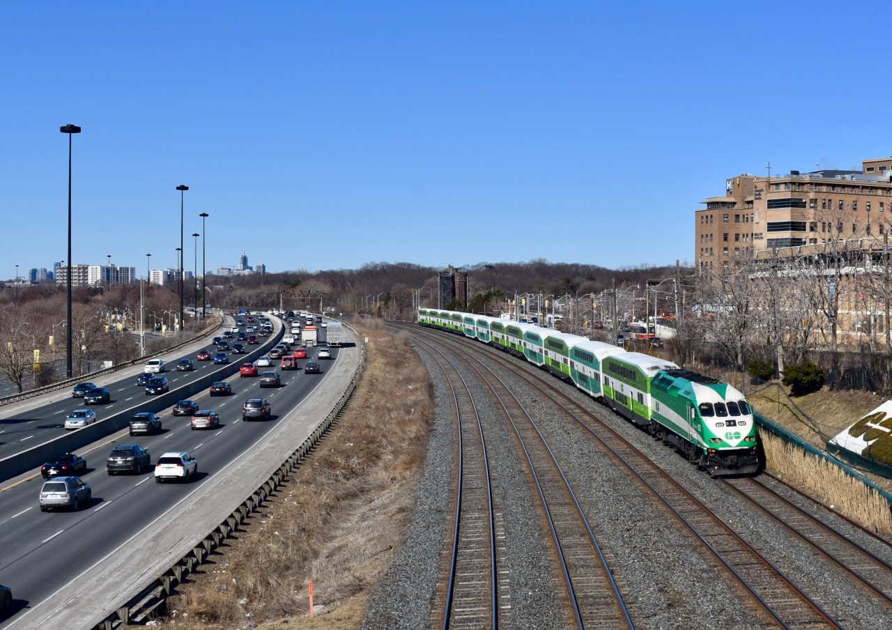 Having left Union Station moments ago, GO transit MP40-PH 622 pushes its 12 car mixed Bombardier train westbound along the Oakville Sub. In this scene they are running Parallel to the Gardiner Expressway right near Lakeshore and it is a beautiful early spring morning. I always wonder if eventually all the GO Transit Coaches and locomotives will be repainted to the new metrolink scheme but I guess only time will tell. It has to be a good 4 years I’d say where it would be quite common to spot a mixed GO train in Ontario.