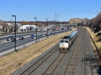 Running parallel along the Gardiner Expressway and heading towards bustling Downtown Toronto, VIA Rail wrapped F40-PH 6416 leads a loaded 4 car passenger train eastbound towards Union Station on a beautiful sunny early spring morning! Time was 09:41 