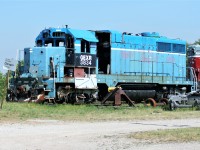On a hot summer afternoon, the shell of retired Goderich-Exeter Railway (GEXR) GP35m 3834 and GP9 901 bask in the sun beside the former CN Goderich, Ontario station. Even in their dilapidated state, the pair are still earning their keep on GEXR, by providing usable parts to keep the rest of the GEXR four-axle motive power operating daily and earning their keep. Both units would eventually be scrapped at Goderich along with several other parts locomotives in the years that followed.