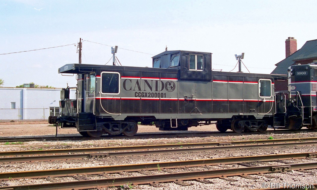A closer view of Cando Contracting's caboose CCGX 200001 sitting at the OBRY Orangeville Yard with 1000 in 2001. The Canadian Trackside Guide lists 200001 as the former CN 79843 (rebuilt from a boxcar by CN in 1976), changing hands to Simins Systems in 2000 before being sold to Cando and briefly operating on the BCRY and OBRY before being sent west to Cando's Athabasca Northern (ANY) operation in November 2002.