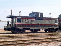 A closer view of Cando Contracting's caboose CCGX 200001 sitting at the OBRY Orangeville Yard with 1000 in 2001. The Canadian Trackside Guide lists 200001 as the former CN 79843 (rebuilt from a boxcar by CN in 1976), changing hands to Simins Systems in 2000 before being sold to Cando and briefly operating on the BCRY and OBRY before being sent west to Cando's Athabasca Northern (ANY) operation in November 2002.