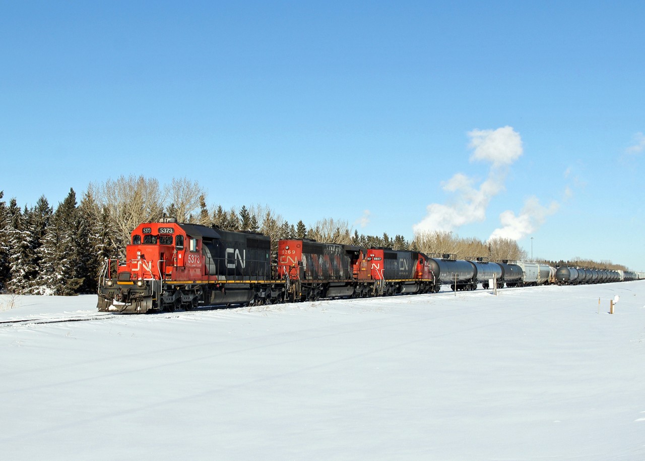 SD 40s at work on the Fort Saskatchewan Industrial Lead out of Scotford.  Ex UP SD40-2 units CN 5373 leading and CN 5937 at  the rear. in the middle SD40-2(W) CN 5269.