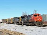 CN 8909 and GECX 9142 sit in the siding at East Edmonton waiting for the road south on the Camrose Sub.
