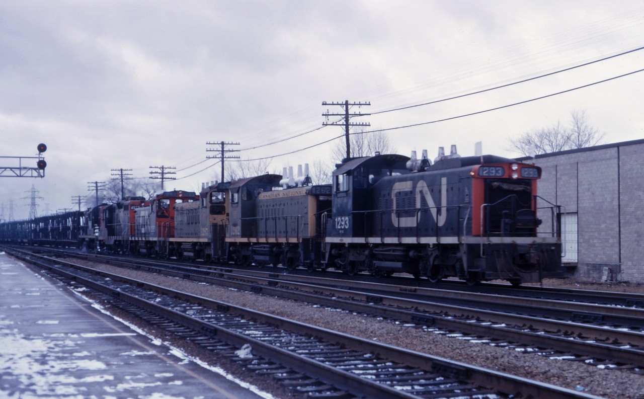 Six units (SW1200RS 1293, 1262, 1287, and 1265, GP9 45xx, and an RS18) start up the Halton sub with an eastbound freight. Yes, that order of units is correct--due to control issues, SW1200RS (and GMD1) units were supposed to lead bigger units in such lash-ups! (Perhaps another member can explain the exact reason.)