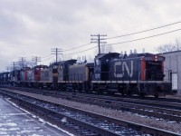 Six units (SW1200RS 1293, 1262, 1287, and 1265, GP9 45xx, and an RS18) start up the Halton sub with an eastbound freight. Yes, that order of units is correct--due to control issues, SW1200RS (and GMD1) units were supposed to lead bigger units in such lash-ups! (Perhaps another member can explain the exact reason.)