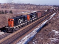 CN RS18 3739 and GP9 4493 start a westbound freight up the "Copetown Hill". The train is just west of Old Guelph  Road and the CP Goderich sub (approximately mile 1, Dundas sub).
