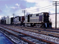 CN RS18 3866 and GP9 4562 start up the Halton sub with an eastbound train.