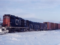 A freight works the west leg of the wye in Burlington in early 1969. Note the dimensional load cars and the crewman "on the ground", as well as the interesting GP-9 4149/CPB-16-5 lashup!