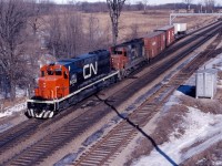 CN SD40 5035 and GP35 4001 work Aldershot yard in February 1968. The 5035 was built in early 1968 and may be on one of its early "shake-down" runs; the 4001 was built in August 1964 and was one of only two such units on CN. (The current GO station and parking lot would be to the north of the units in this view taken from the Waterdown Road bridge.)