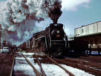 On March 4, 1962 CN and the UCRS sponsored an excursion between Toronto and Niagara Falls. Here we see the train at Aldershot--note the station building with train order signals on the north side of the tracks (it was still movement by signal indication Rule 251 territory--ABS in 1962) and the cold storage building on the south side of the train. Viewed from today's perspective, it seems amazing that enthusiasts and the general public would be allowed all over a "live" railway back then.