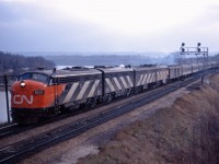 FP9 6520, F9B 6632, and an unidentified CPB16-5/CPA16-5 combination lead an eastbound train through Bayview on a dull day in late 1967 or early 1968 (this Kodachrome slide processed January 1968). While passenger locomotives have largely been repainted into the "new" CN scheme, four of nine cars in this train are still the 1954 green and black paint--including two clerestory roof cars; older cars such as these would start to be retired in the early 1970s as CN began to retreat from aggressive passenger train marketing.